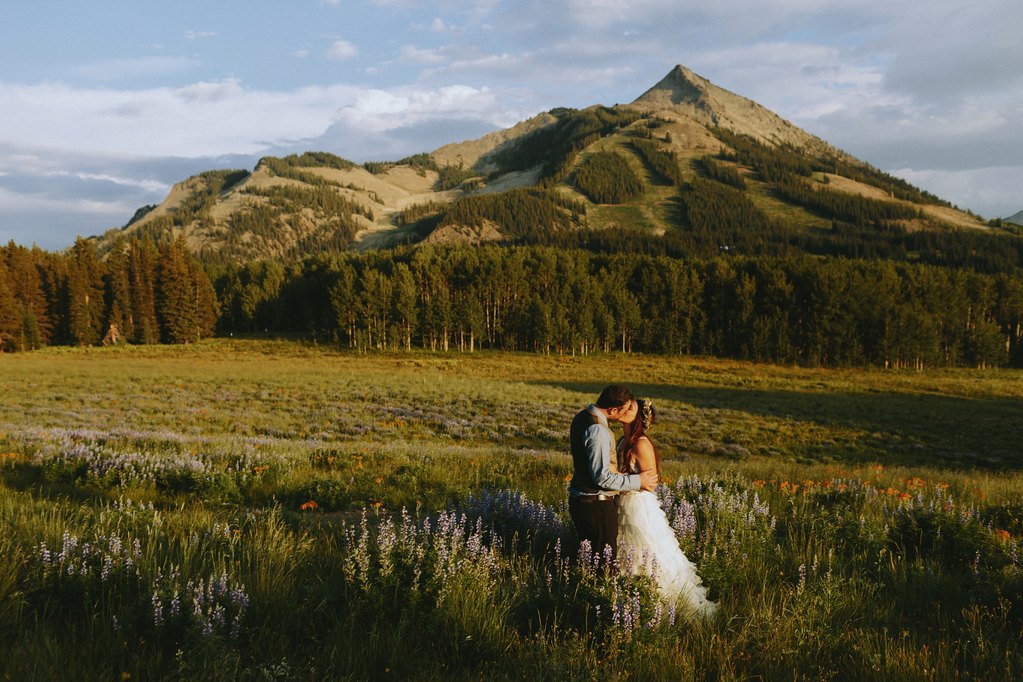Bride and groom with mount Crested Butte in the background