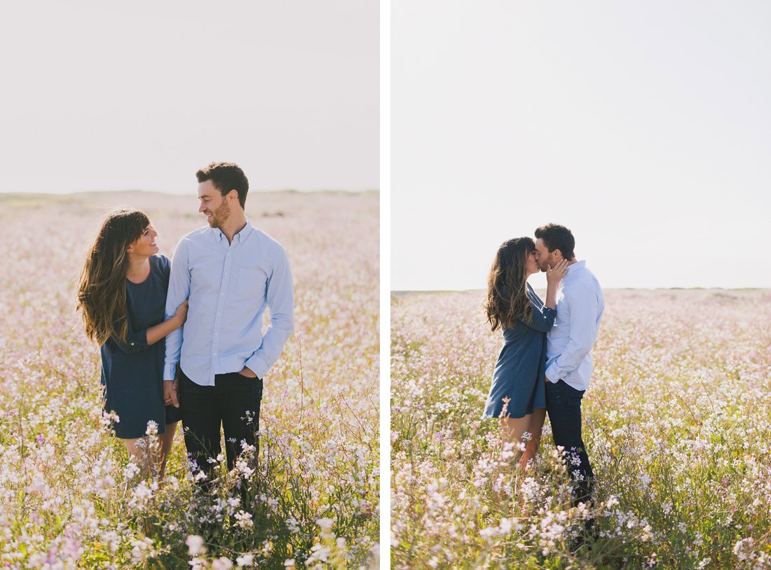 Engagement photos taken in field of flowers
